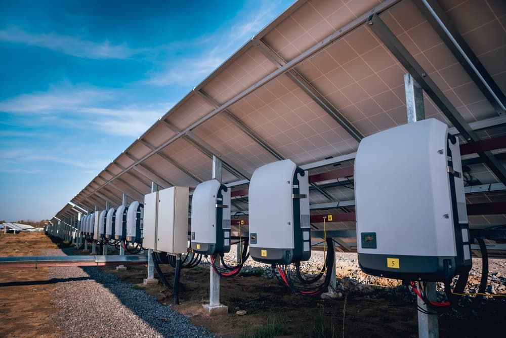 A Row of Solar Panels and Inverters in a Field — SEP Electrical Pty Ltd in Kiama, NSW