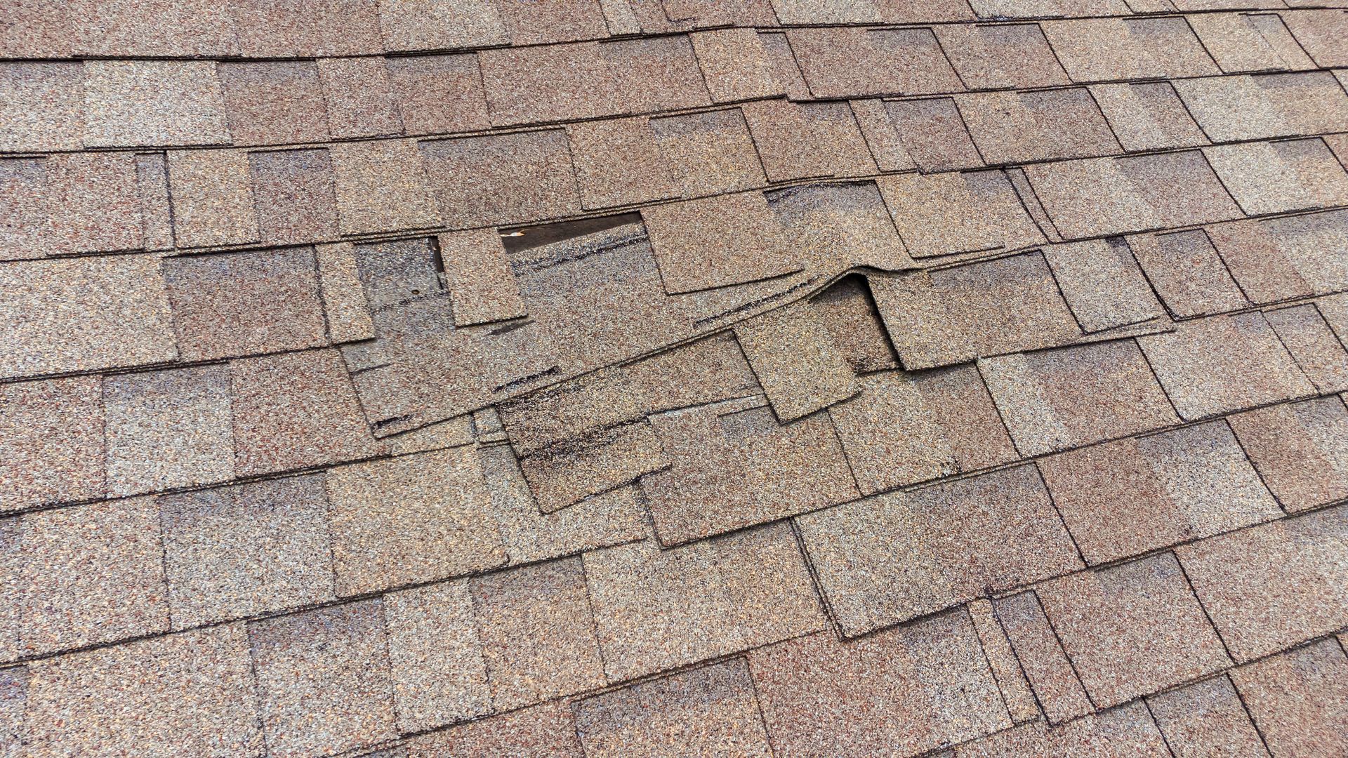 A close up of a roof with a hole in it.