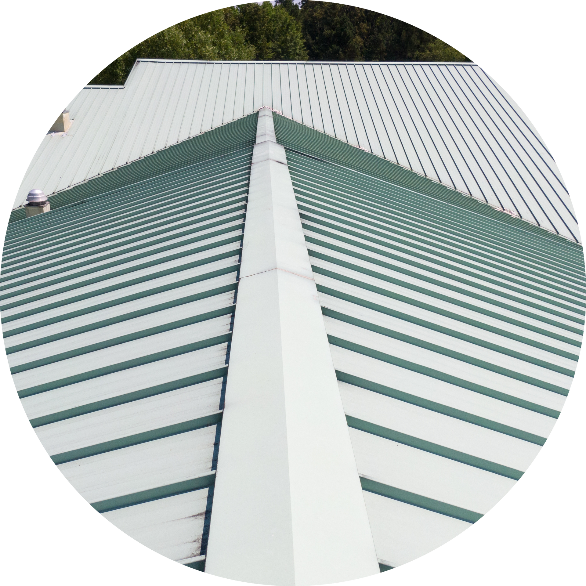 A white roof with green stripes and a white gutter