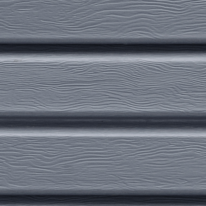 A close up of a gray vinyl siding with a wood grain texture.