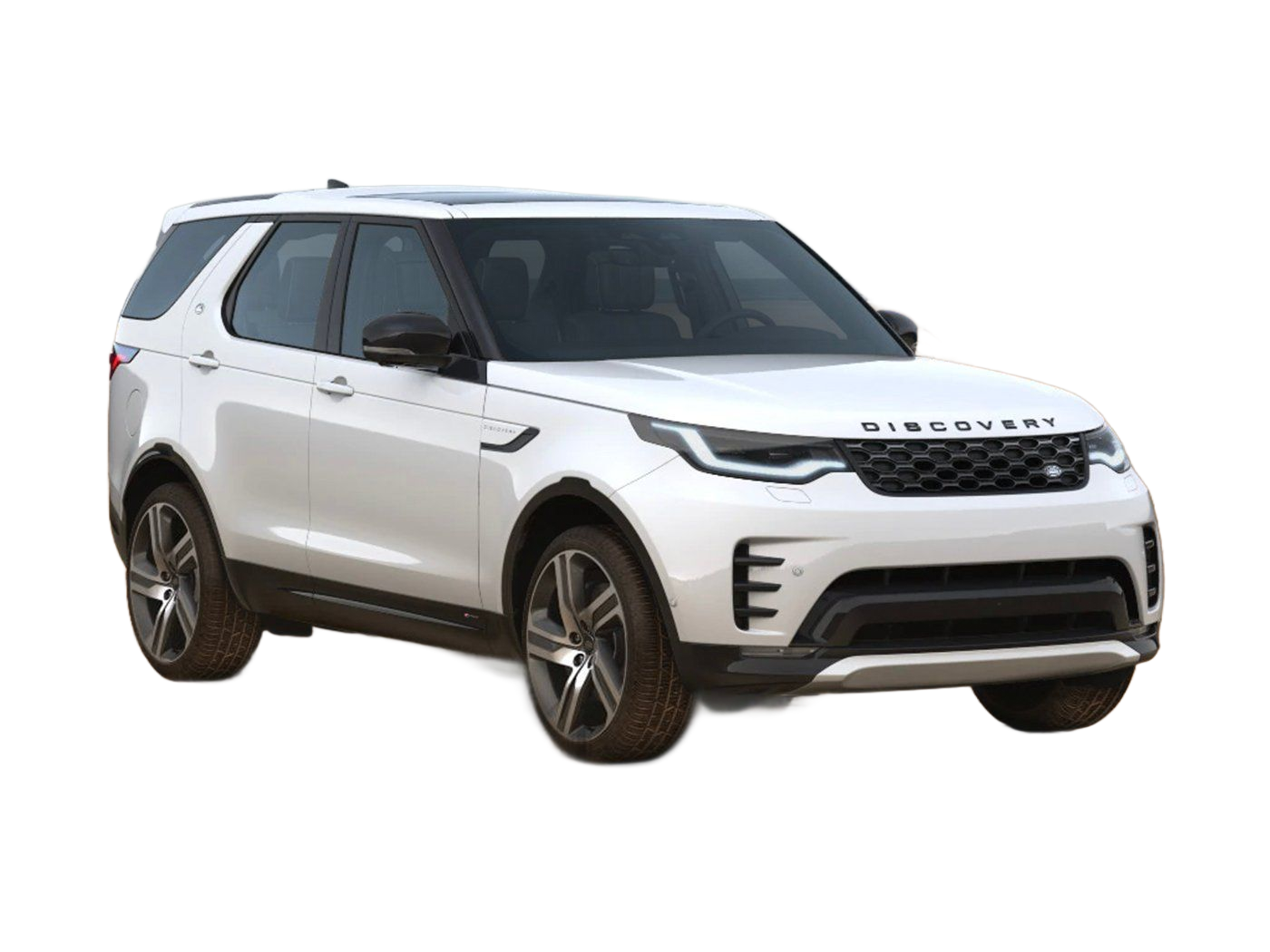 Gray Land Rover Discovery SUV parked outdoors, in front of a wooded area. 