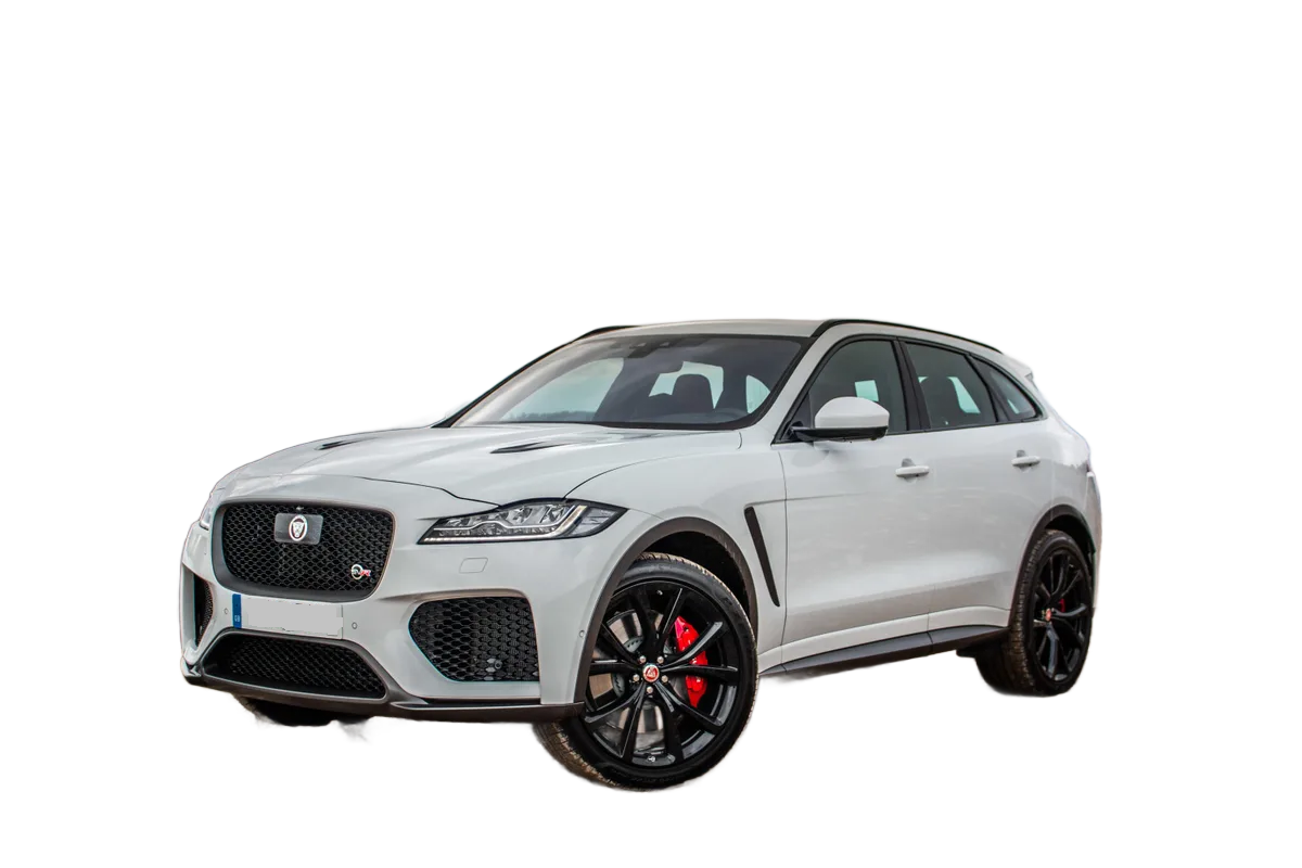 White Jaguar F-PACE SUV with black wheels and red brake calipers, on a white background.