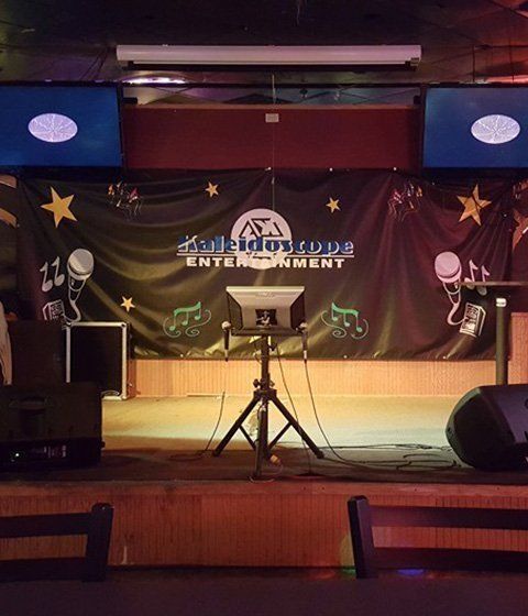 A stage with a sign that says entertainment on it