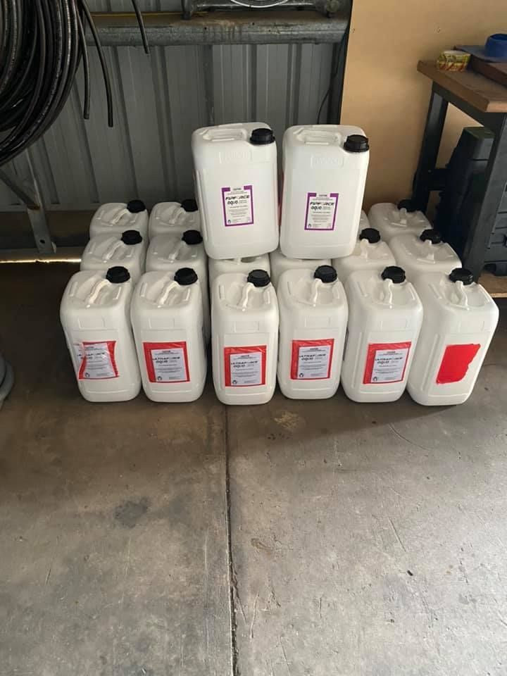 A bunch of plastic bottles are stacked on top of each other — Territory Pest Control In Winnellie, NT