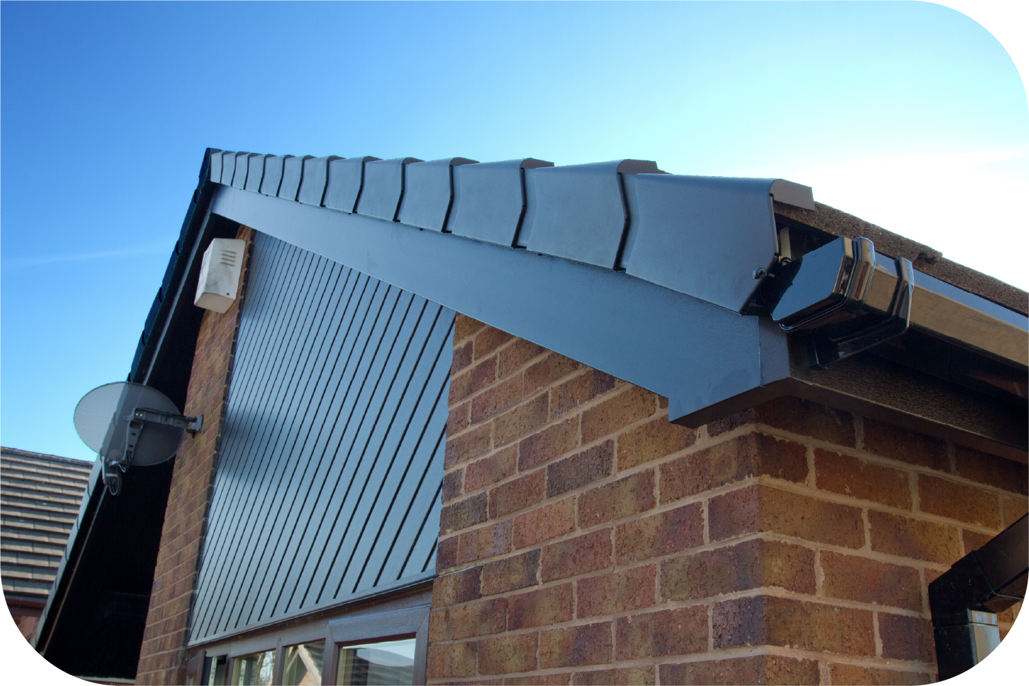 An attic with a pipe covered in aluminum foil