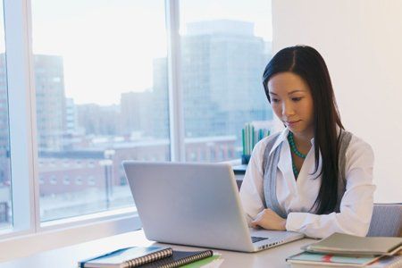A young woman at work on a laptop