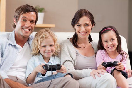 A family playing on a games console