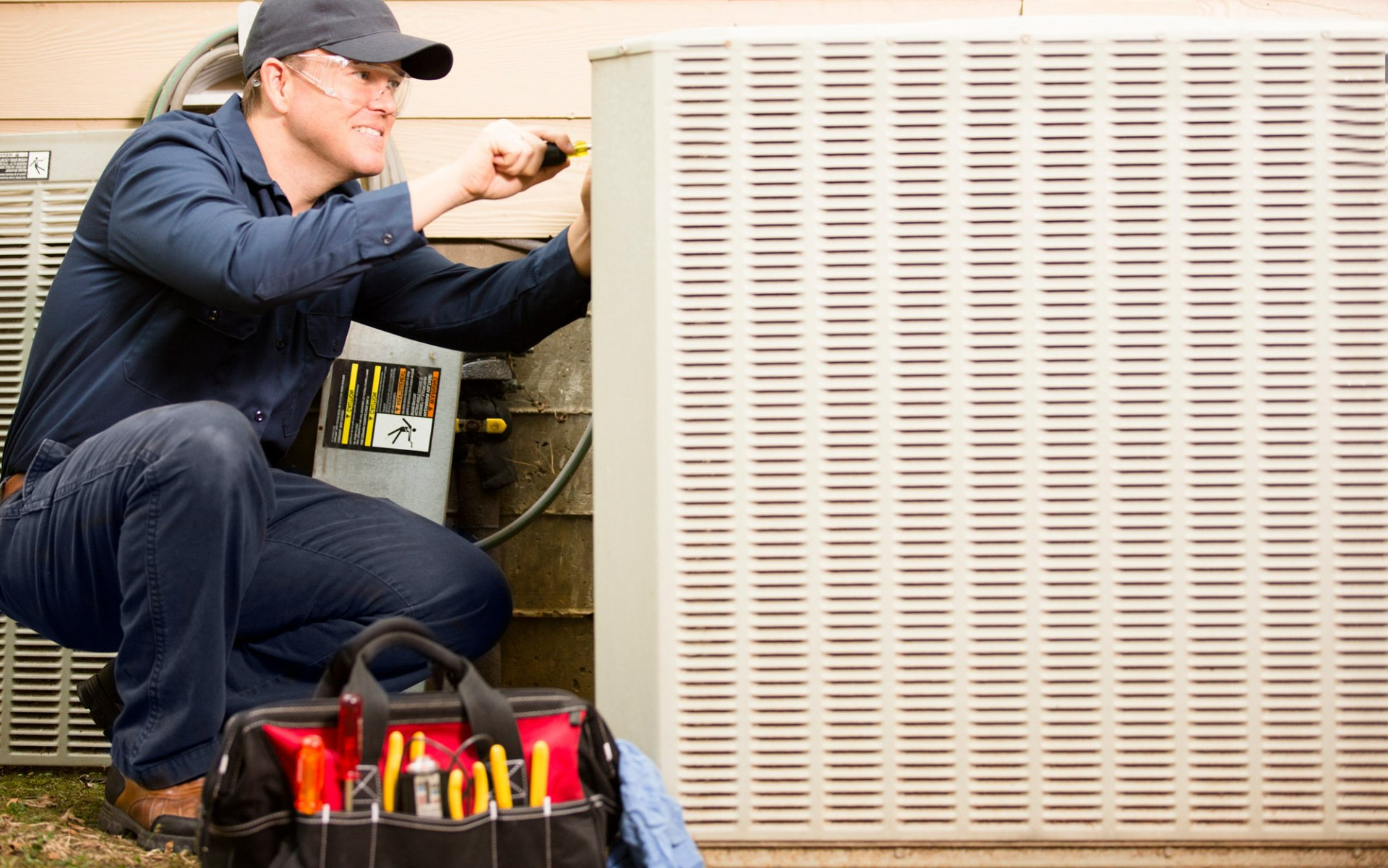 Repairmen works on air conditioner unit | East Victoria Park, WA | Aircon Express Service & Repairs Perth
