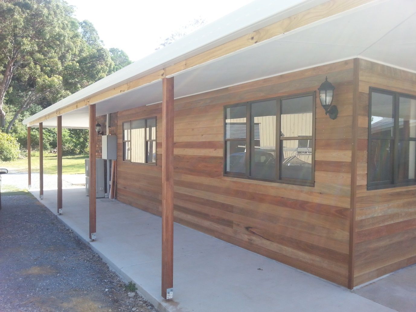 A House With a Covered Porch and a Lot of Windows  — Scott Graham Building Services In Bilambil Heights, NSW 
