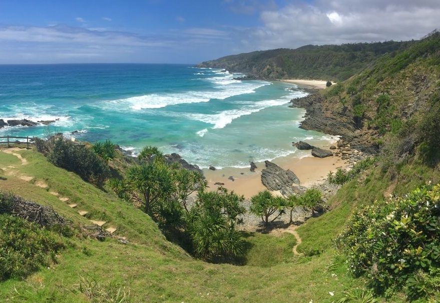 A View of a Beach From the Top of a Hill— Scott Graham Building Services In Byron Bay, NSW