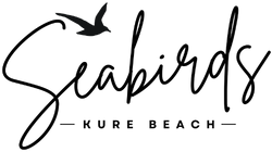 The Carolina Beach Motel logo in navy blue, depicting a sun rising over stylized waves. This logo highlights another local lodging option near Seabirds Motel, offering a similar pet-friendly beachside experience in North Carolina.