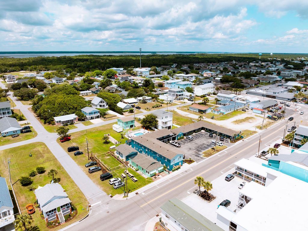 An aerial view of the Seabirds Motel at Kure Beach and its surrounding area, showcasing its convenient location for exploring the coast and enjoying a pet-friendly stay in North Carolina.