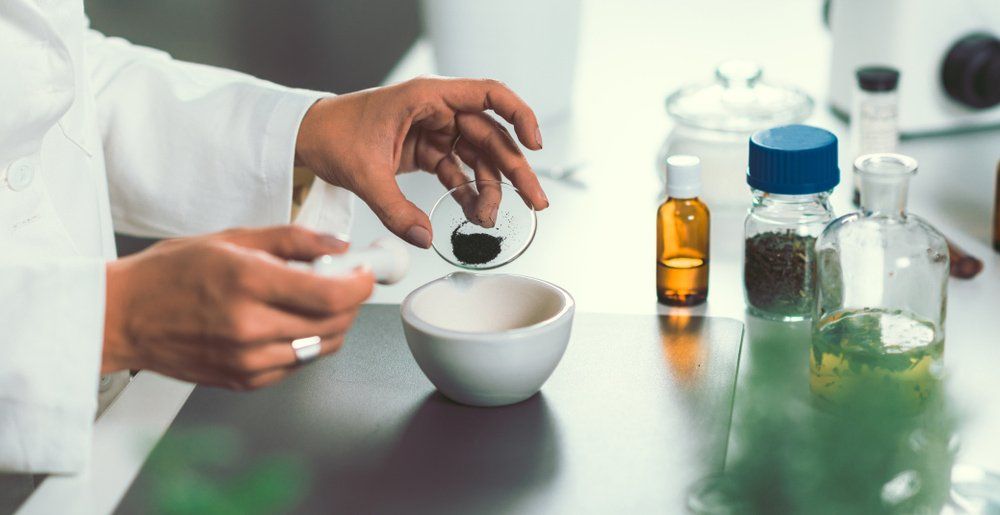 Homeopath preparing alternative herbal medicines — Hormonal Imbalances in Hervey Bay QLD