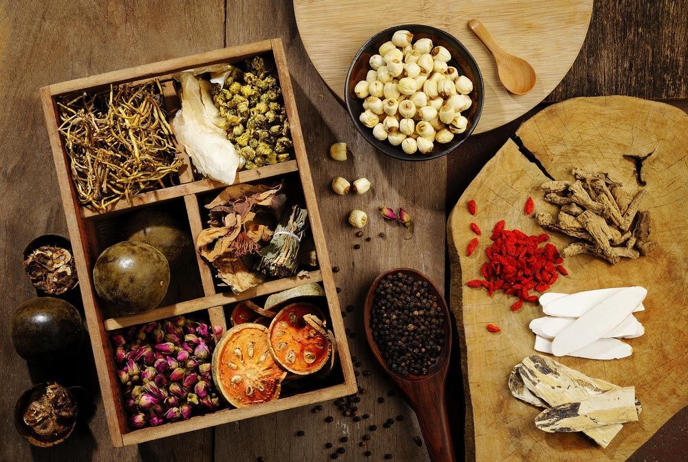 Herbal Medicine And Flower Tea On Wooden — Julie Taylor Naturopath in Maryborough, QLD
