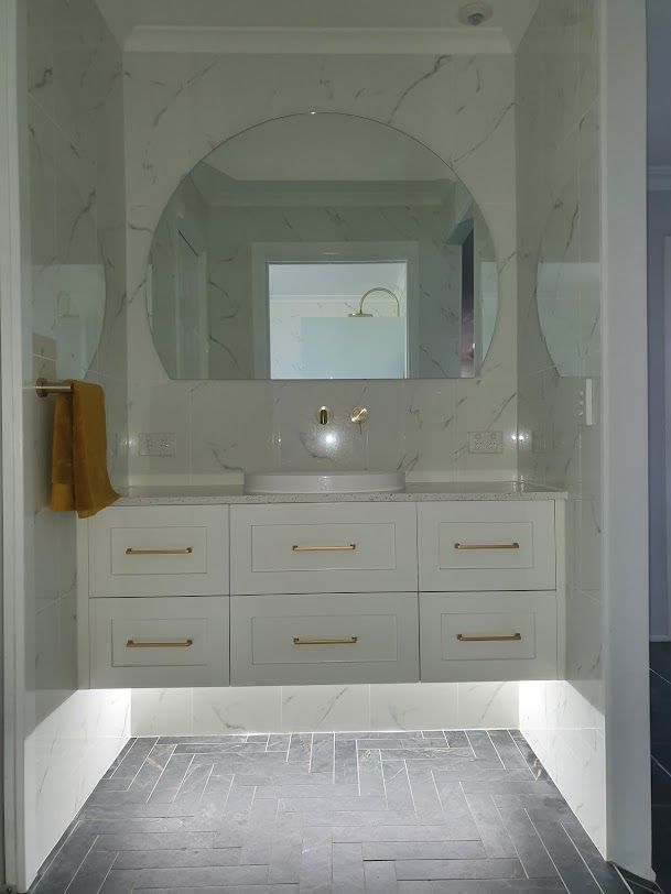 A Bathroom With A Sink, Mirror, And Drawers — Damn Fine Constructions In Bellingen, NSW