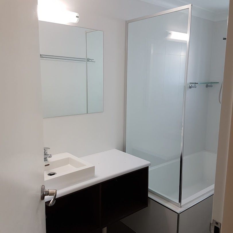 A Bathroom With A Sink And A Walk In Shower — Damn Fine Constructions In Toormina, NSW