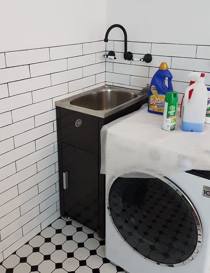A Laundry Room With A Washing Machine And A Sink — Damn Fine Constructions In Bonville, NSW