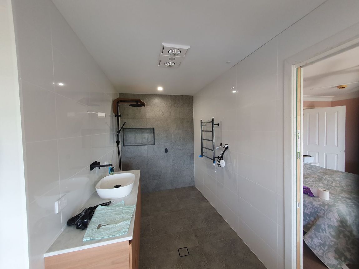 A Kitchen With A Grill, Sink, And Refrigerator — Damn Fine Constructions In Bonville, NSW