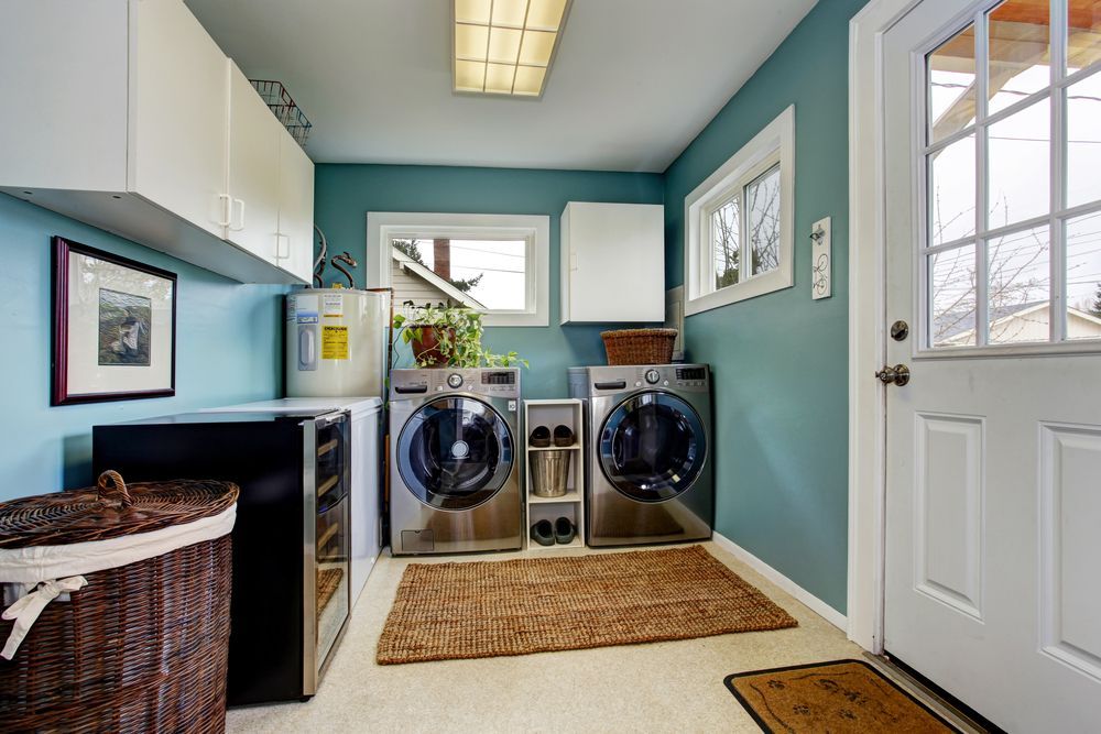 A Laundry Room With Two Washers And Two Dryers — Damn Fine Constructions In Bonville, NSW