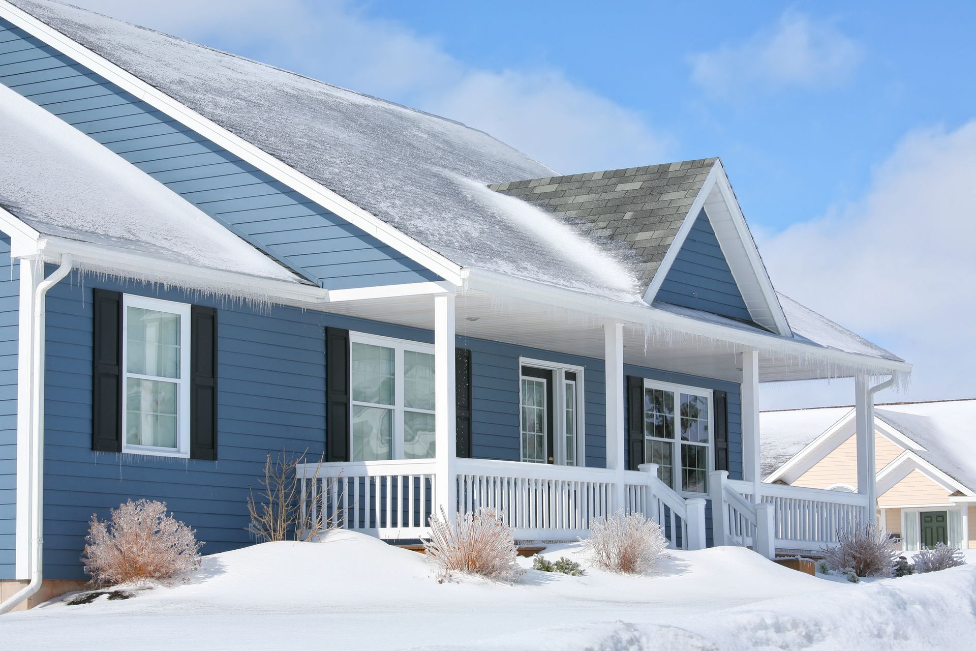 View of a home in need of roof winterization in Marlboro, NJ by Garden State Roofing & Siding Inc. f