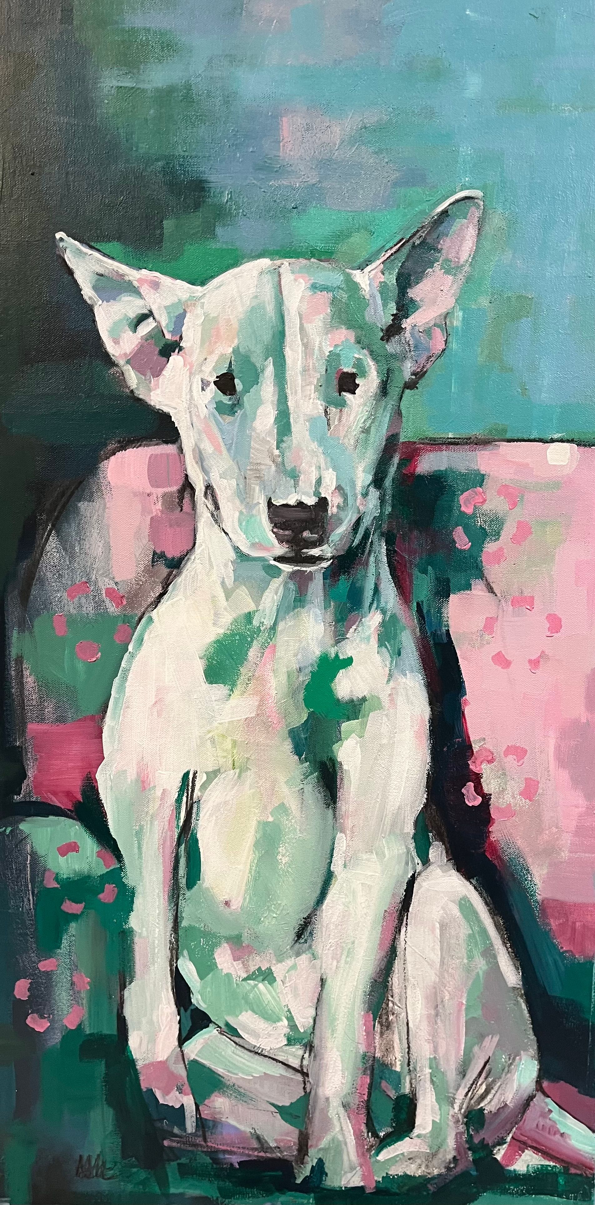 White dog with large ears sitting on a pink cushion against a teal background.