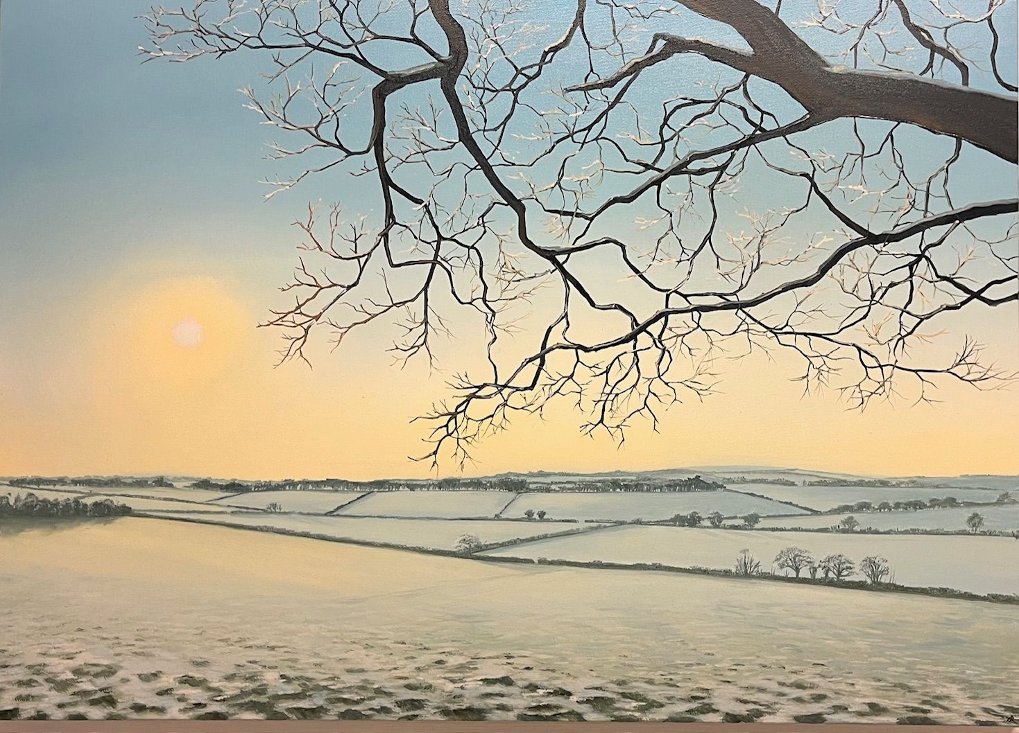A landscape painting features a large, bare tree branch overlooking a vast, snow-covered countryside under a golden sun.