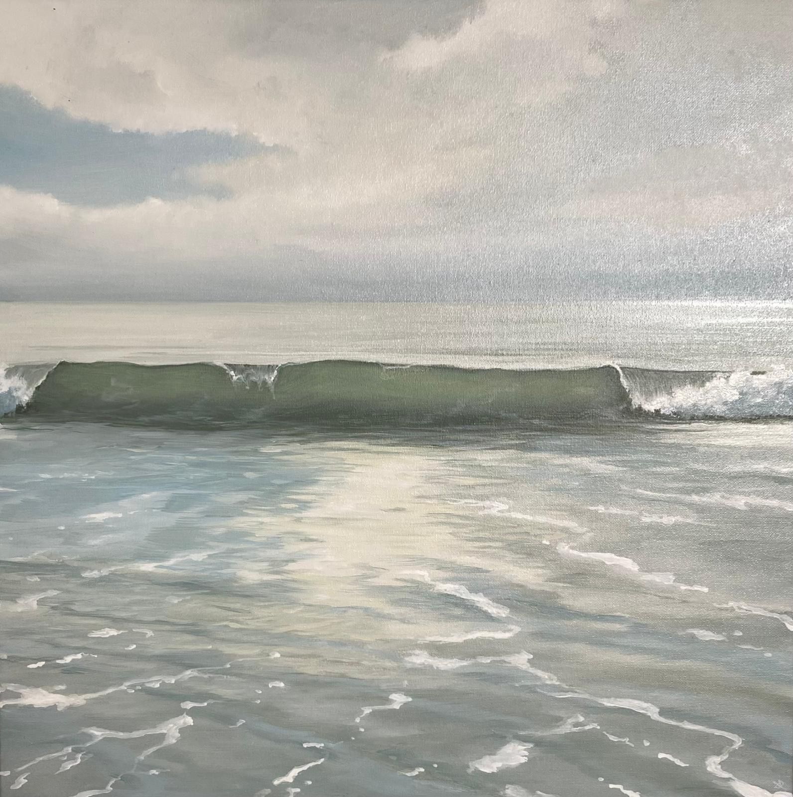 Ocean wave breaking on a calm, misty day; soft blues and greens dominate the scene.