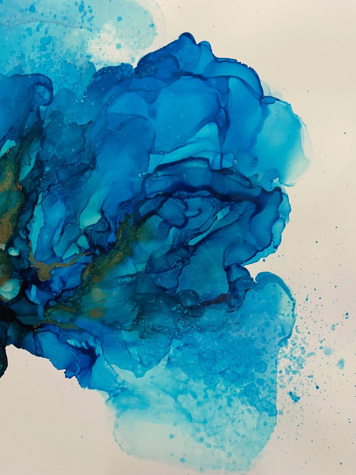 Blue watercolor flower with a delicate stem on a light background.