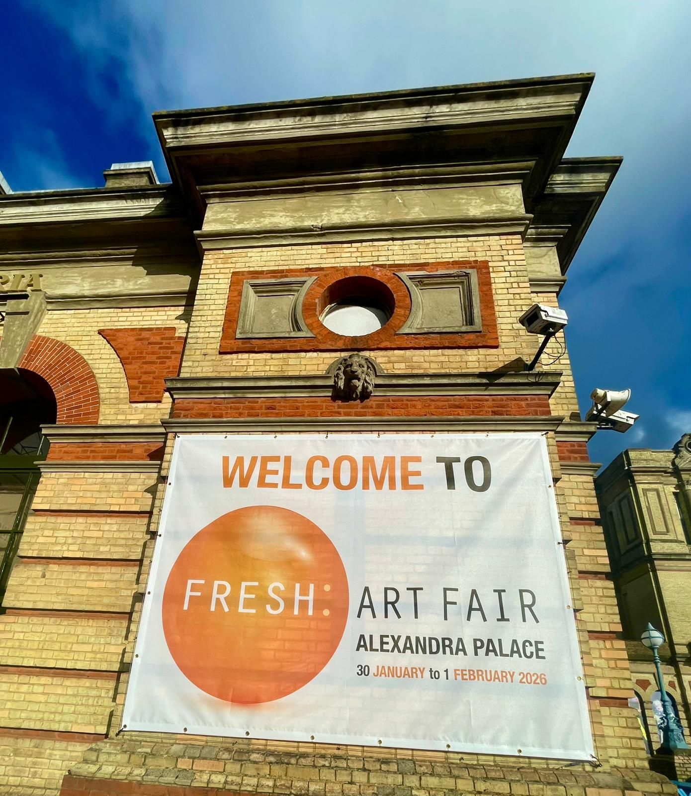 Banner on brick building reads 
