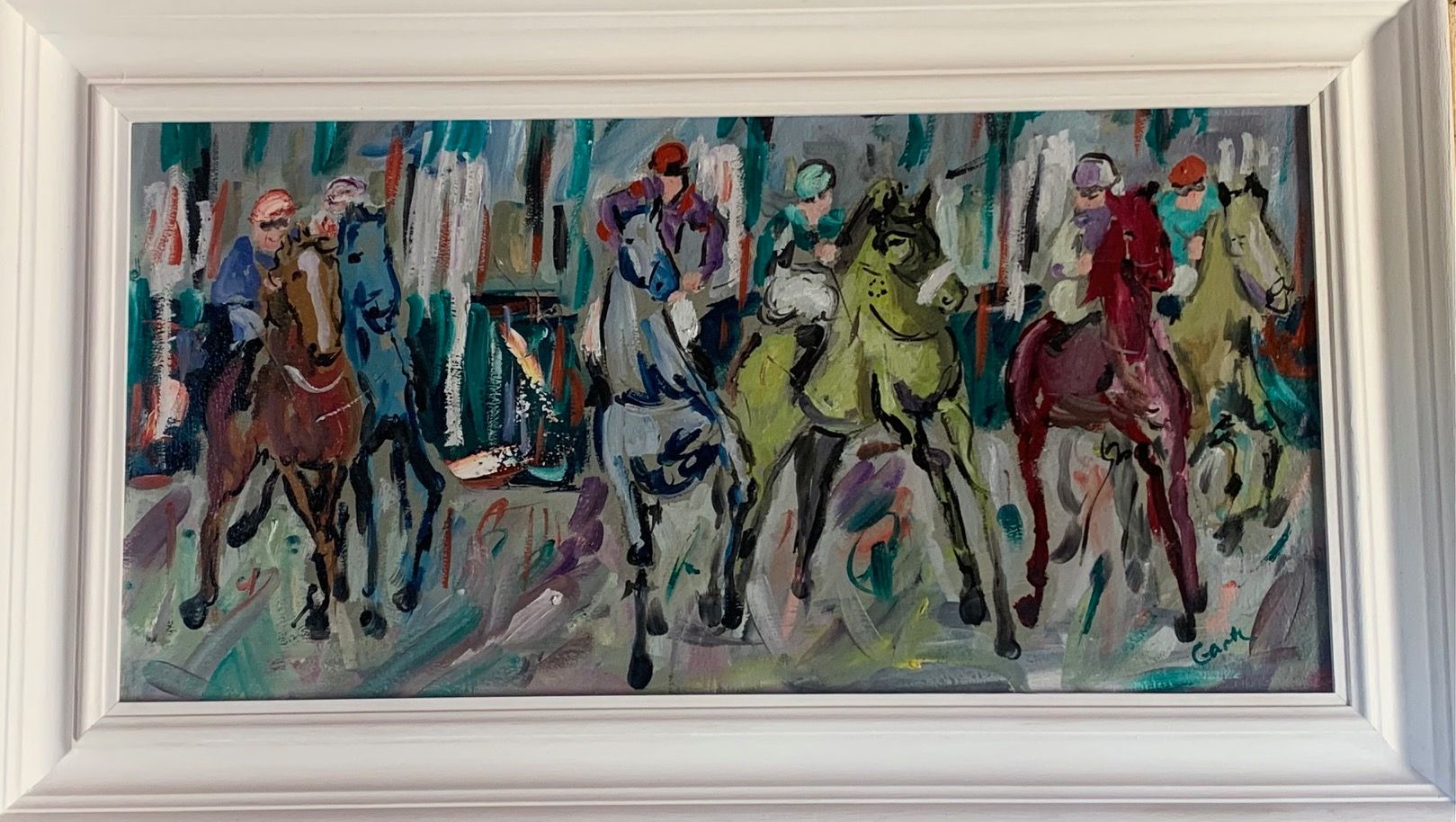 a framed painting of jockeys riding horses from the starting gate