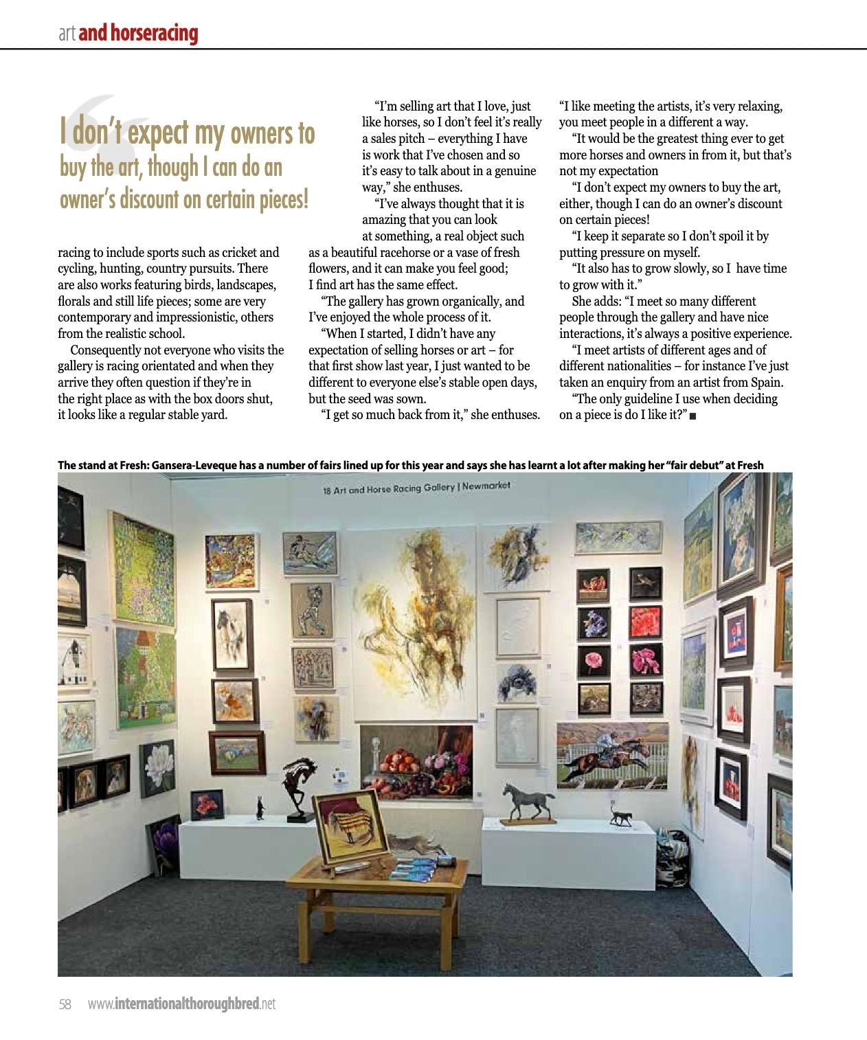 An exhibit filled with lots of paintings and a table.