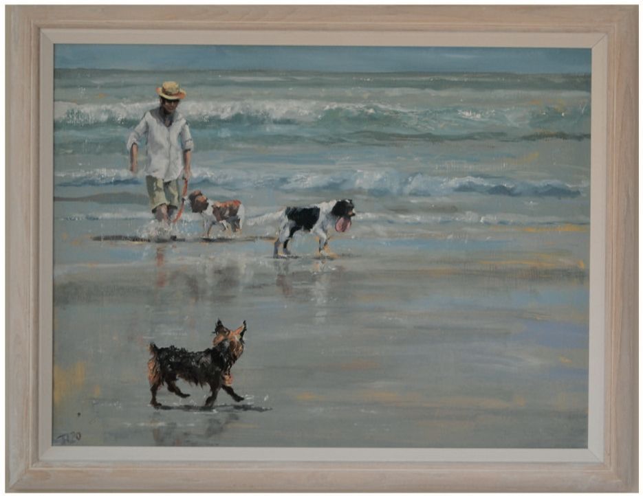 a framed painting of a man walking two dogs on the beach