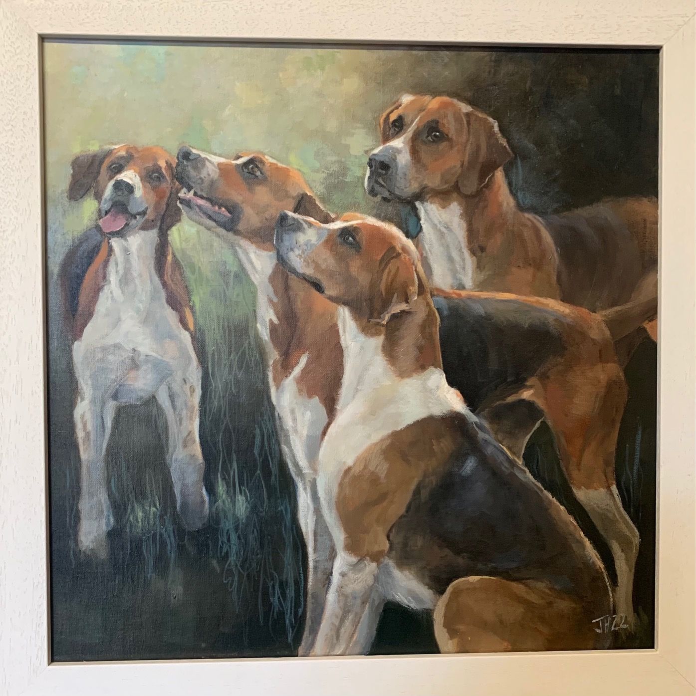 a framed painting of four hounds