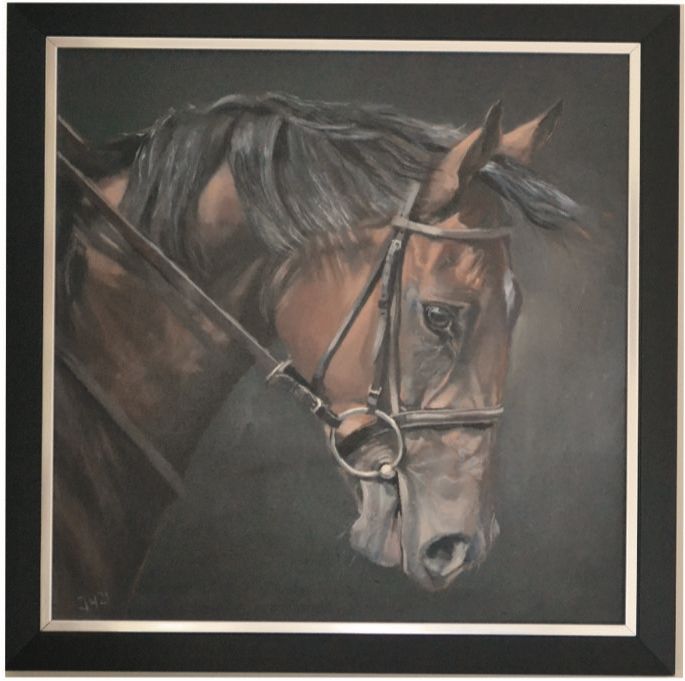 a framed painting of a brown horse with a bridle