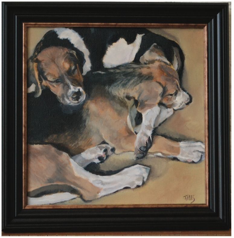 a framed painting of two dogs sleeping