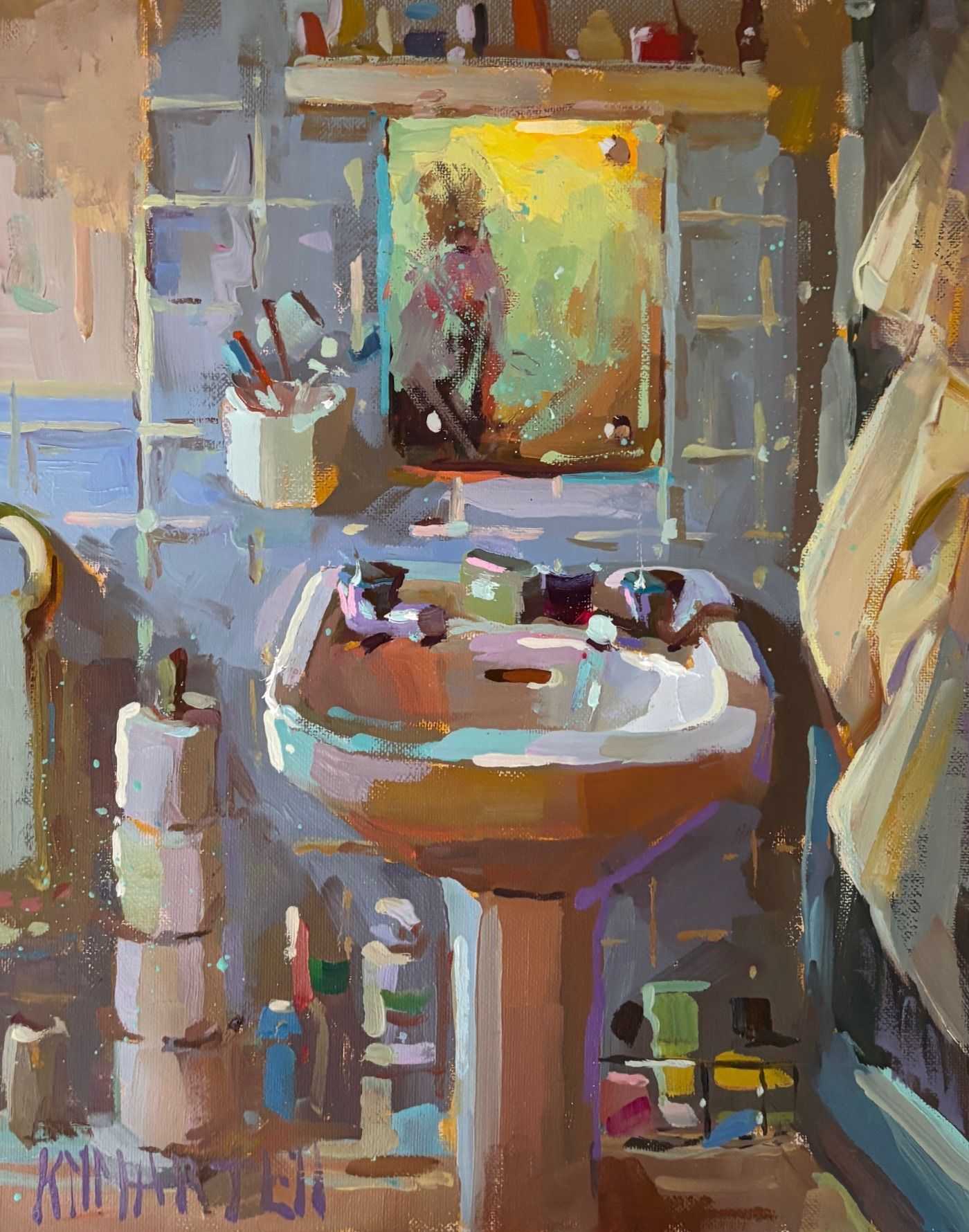 Bathroom with sink, mirror reflection, towels, and toiletries, painted in shades of blue, yellow, and white.