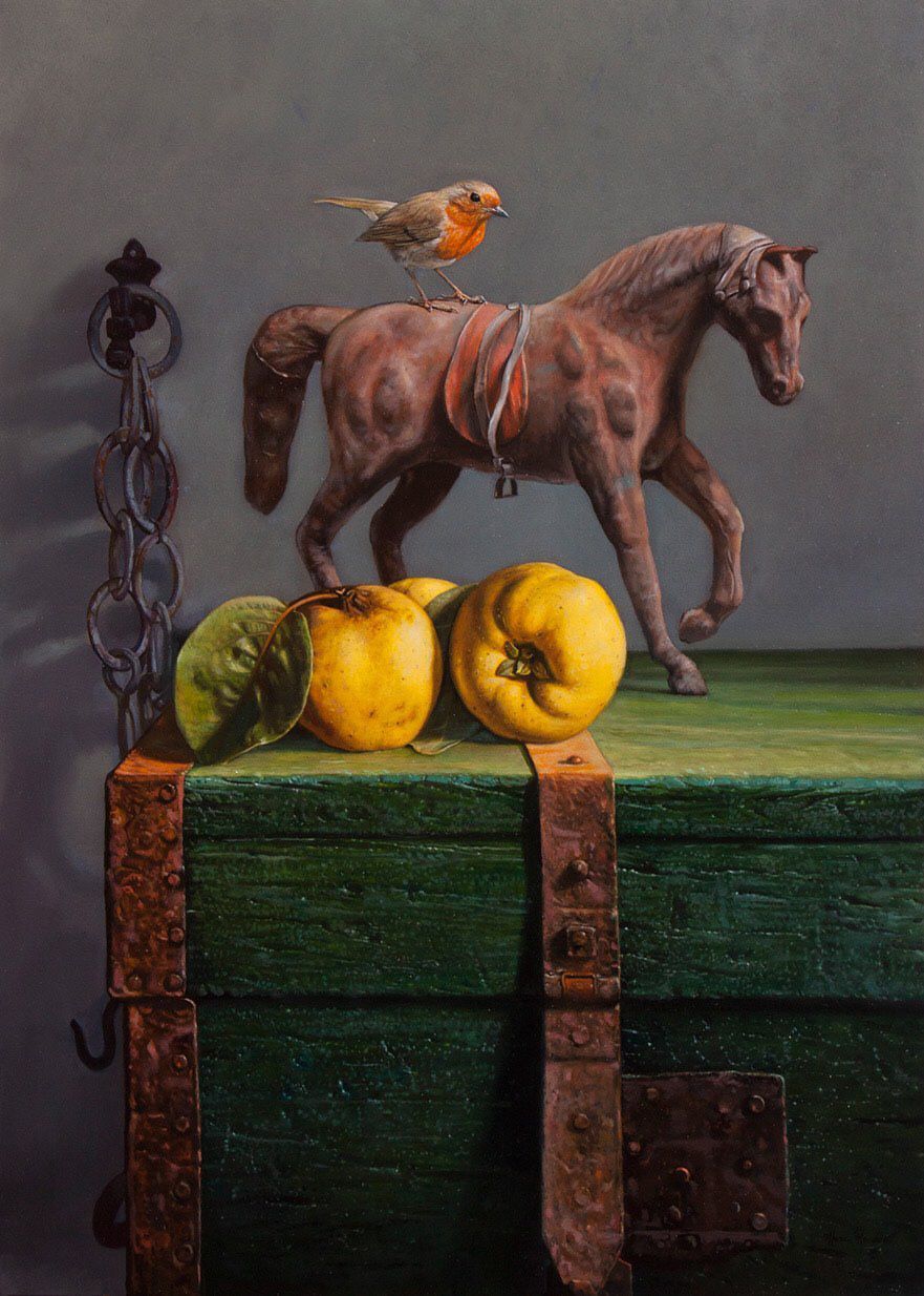 A still life: toy horse, bird, yellow fruit on a green chest, against a dark grey backdrop.
