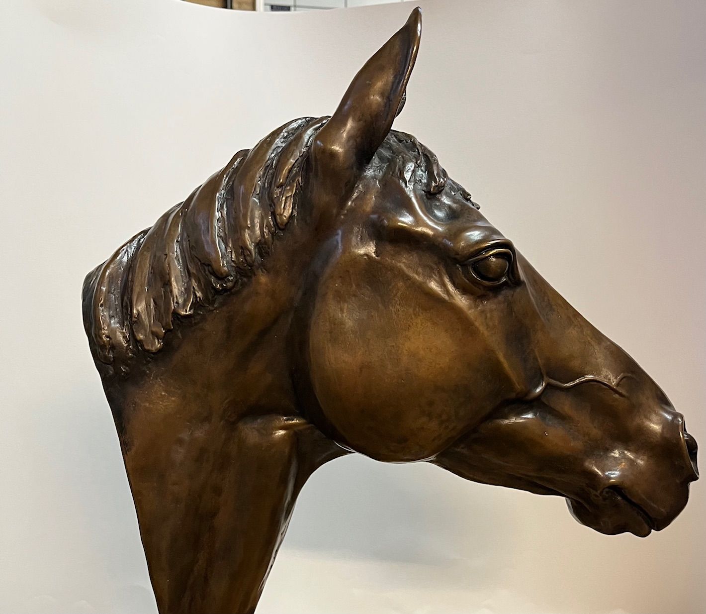 Bronze horse head sculpture.