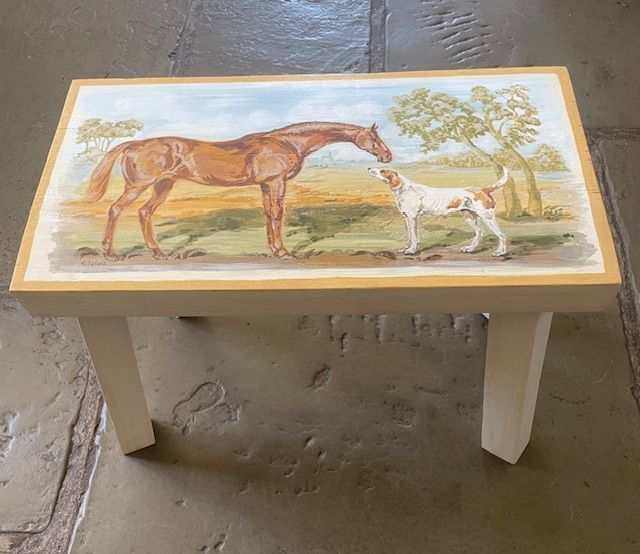 Small painted table with a horse and dog in a pastoral scene.