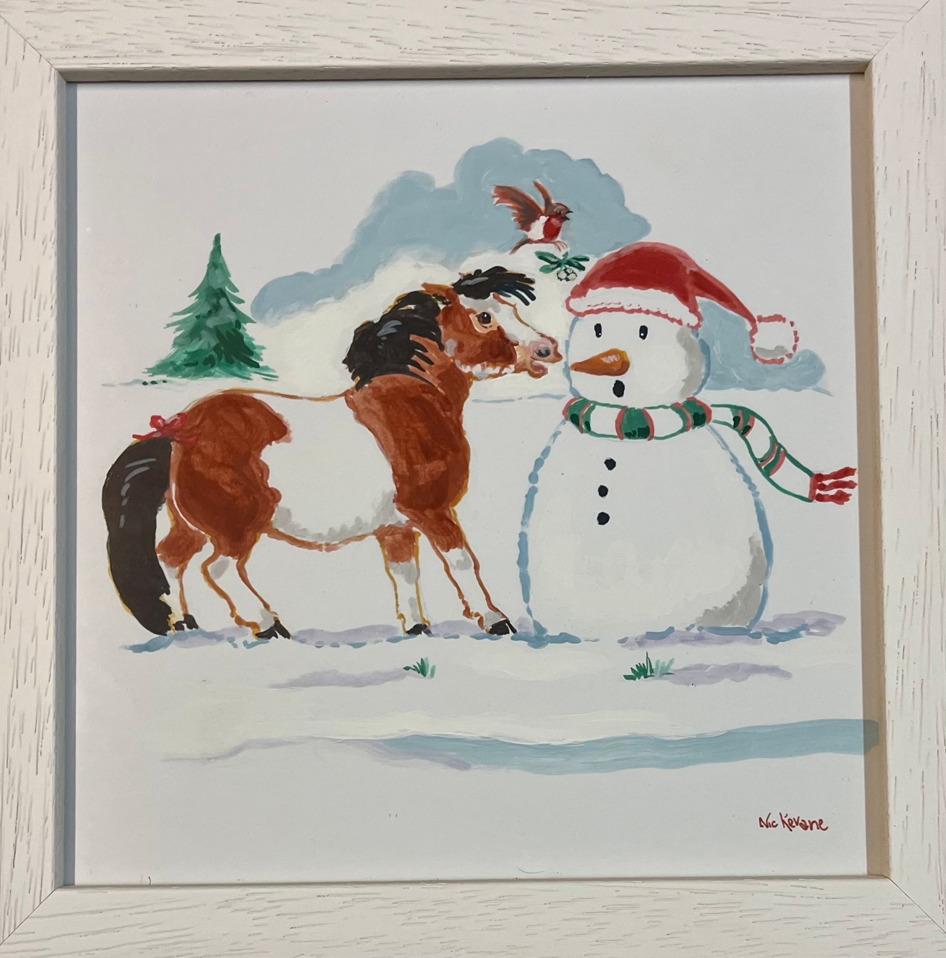 A pony with a red bow sniffs a snowman wearing a Santa hat and scarf in a snowy scene with a cardinal.