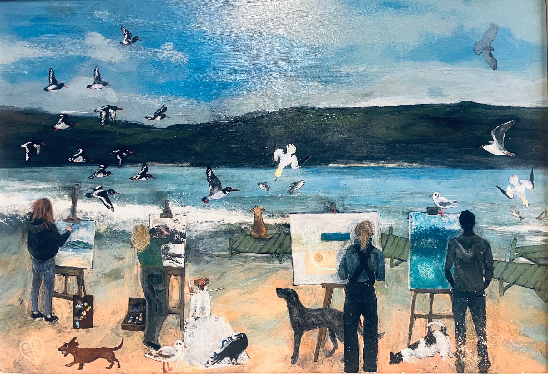 People paint at easels on a beach with birds in the sky and several dogs standing or resting on the sand nearby.