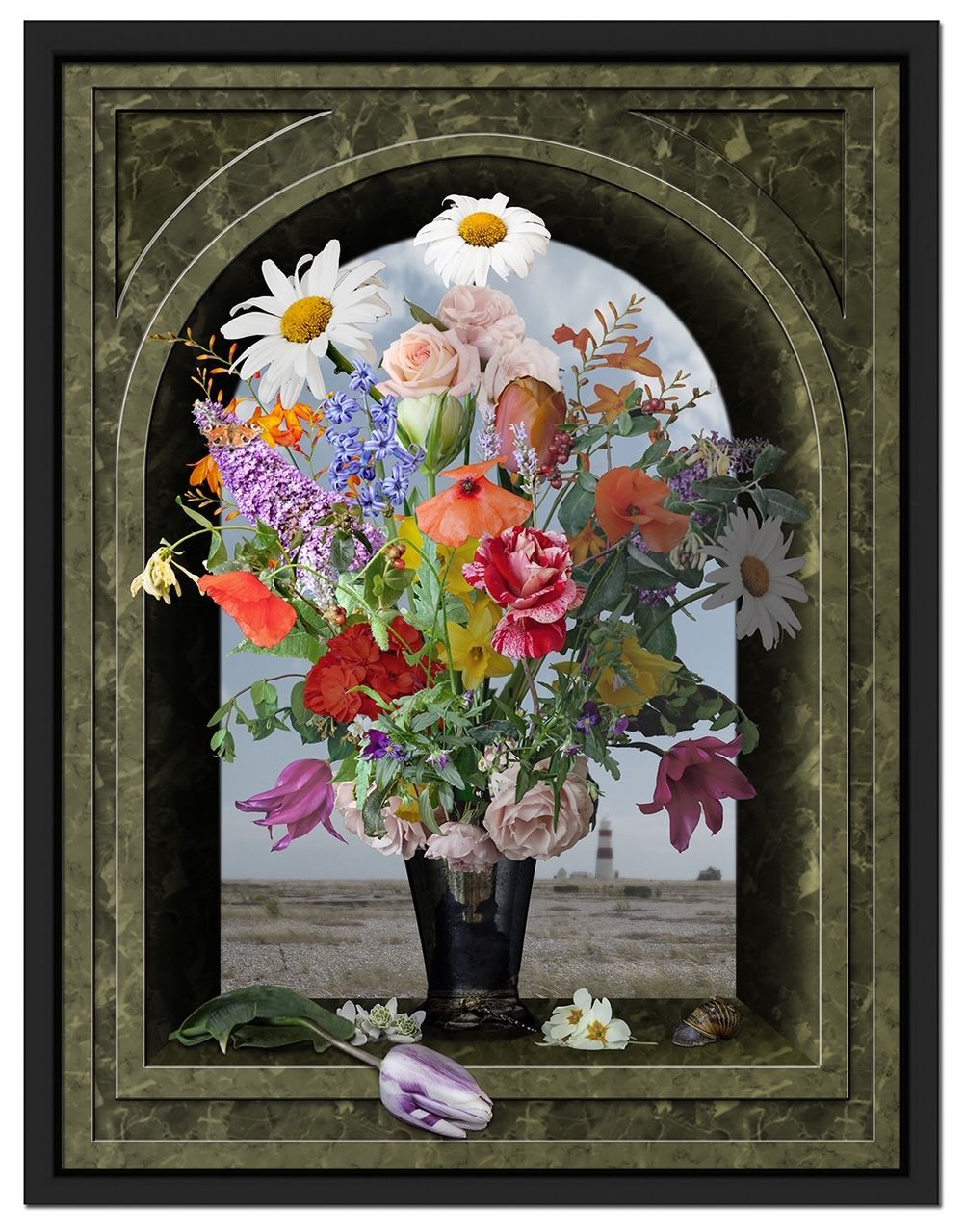 Bouquet of colorful flowers in a black vase, inside a stone archway. A fallen purple tulip lies nearby on a sandy surface.