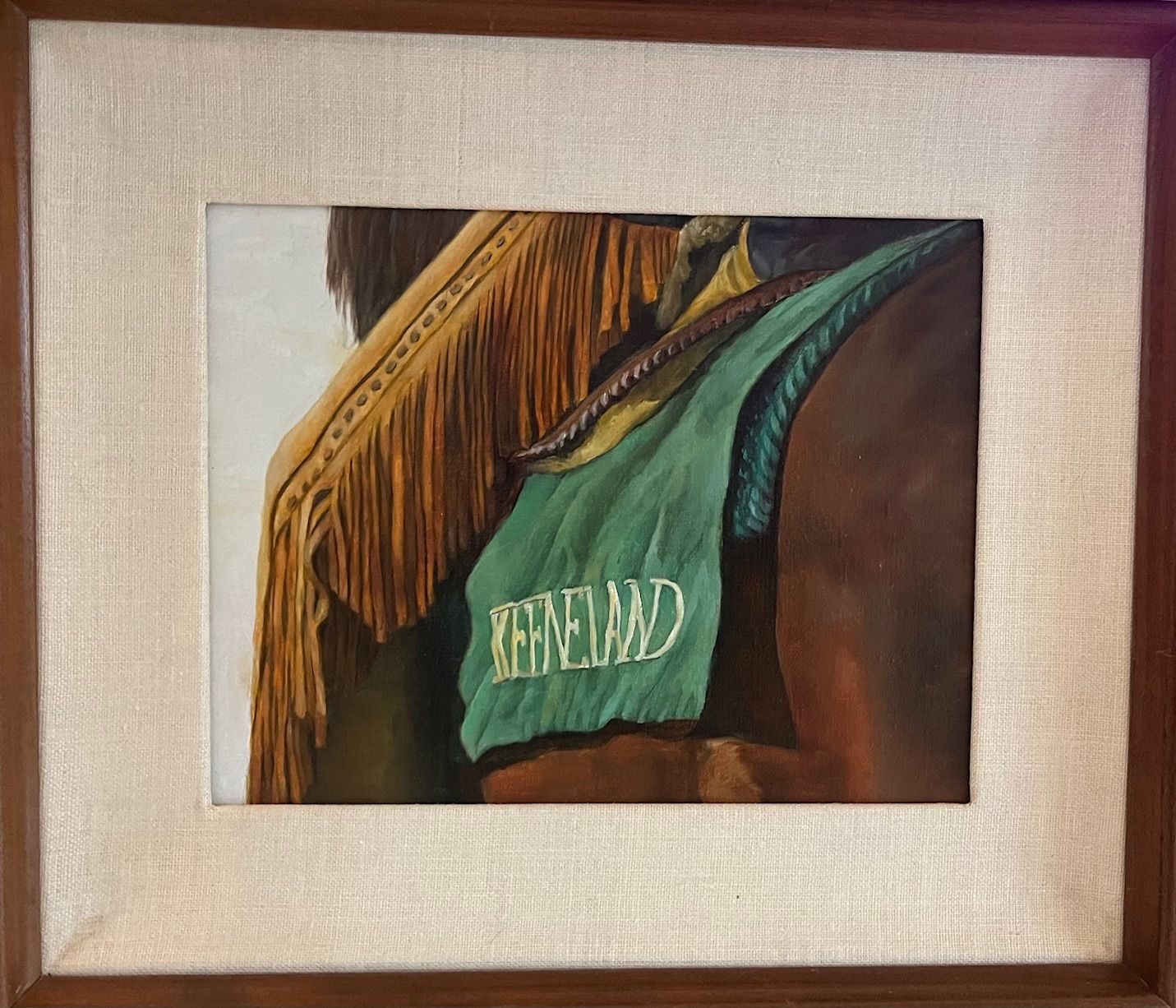 Painting of a horse with a green blanket that says Keeneland