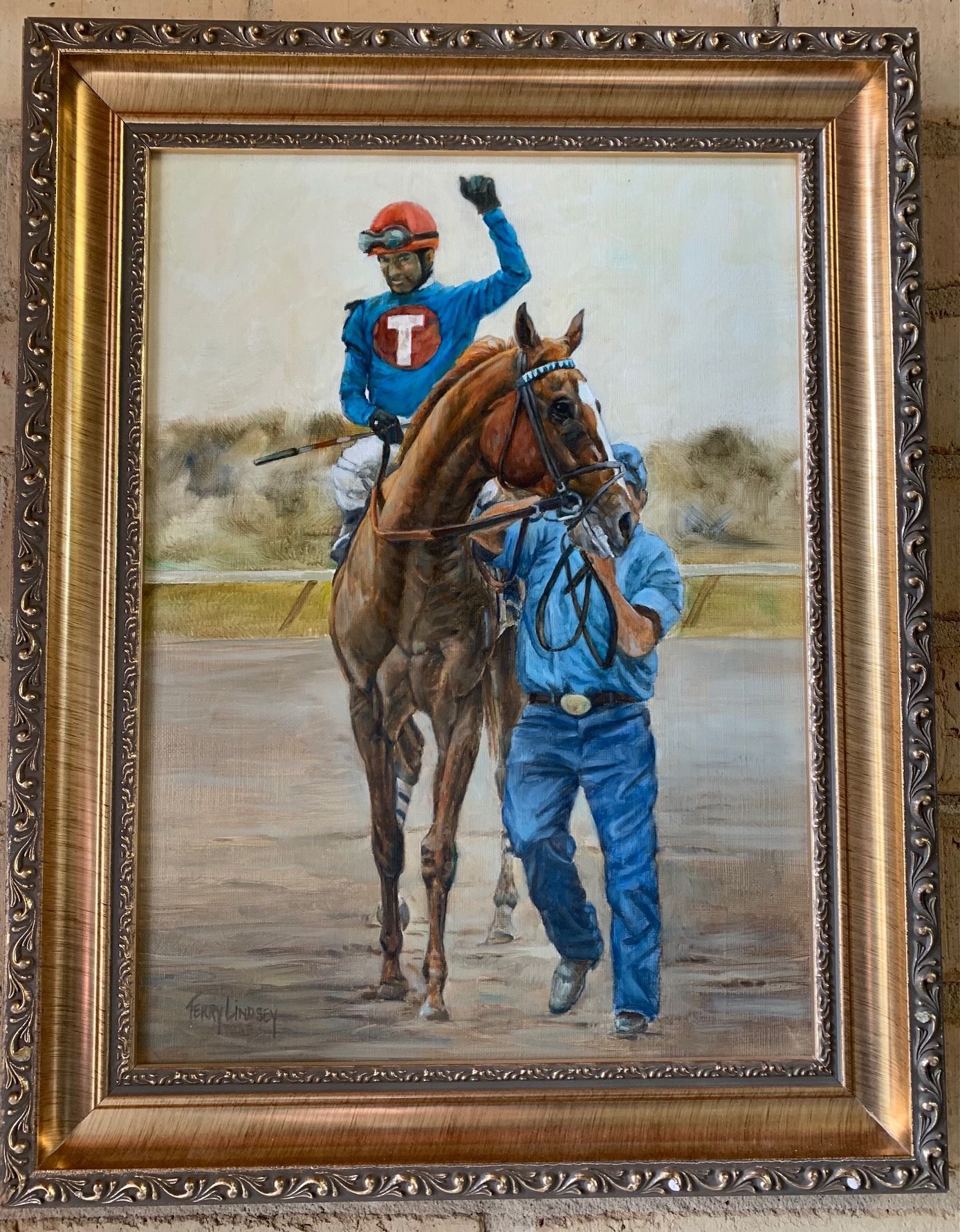 A painting of a jockey riding a horse with the letter t on his shirt