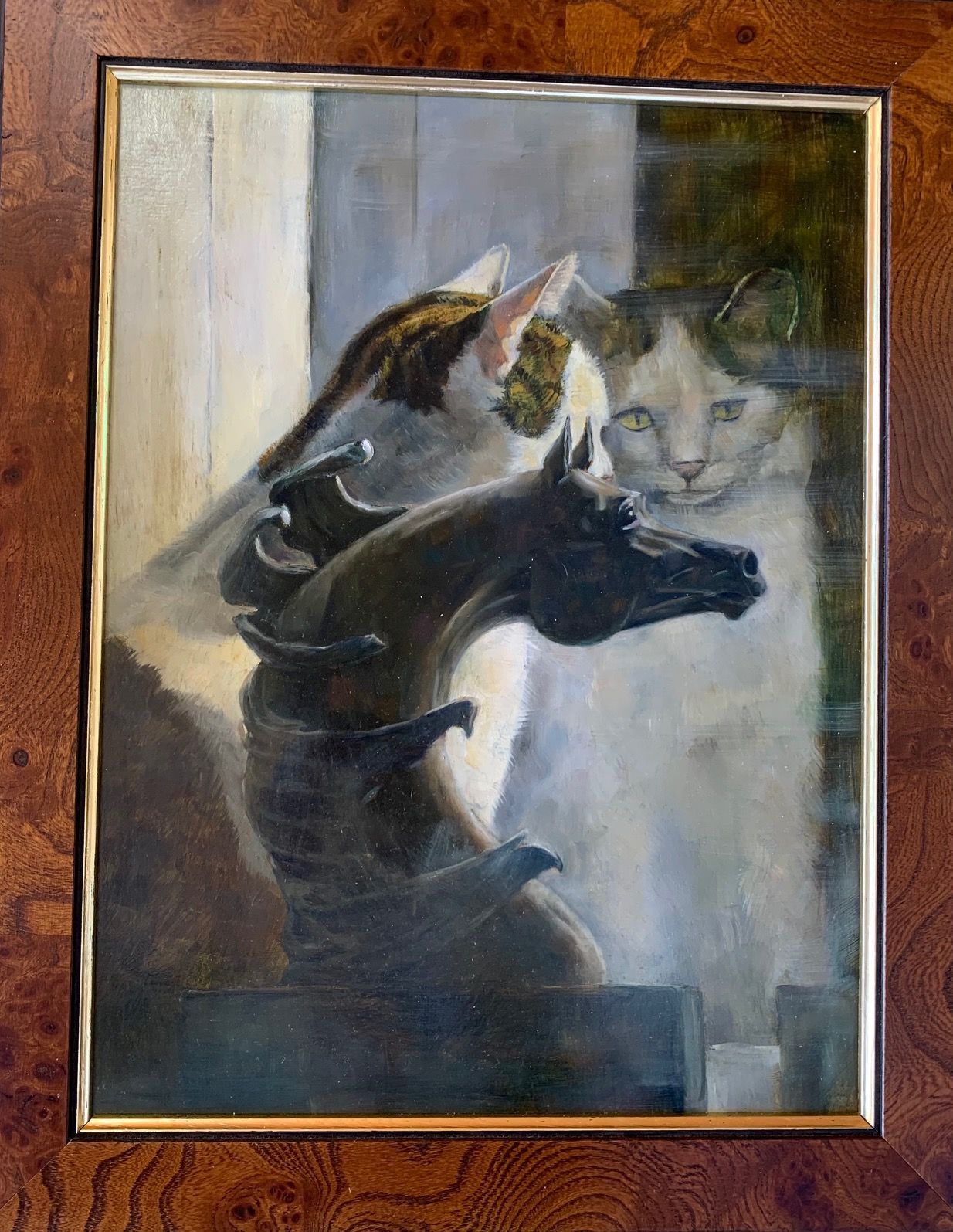A painting of a cat sitting on top of a horse statue.