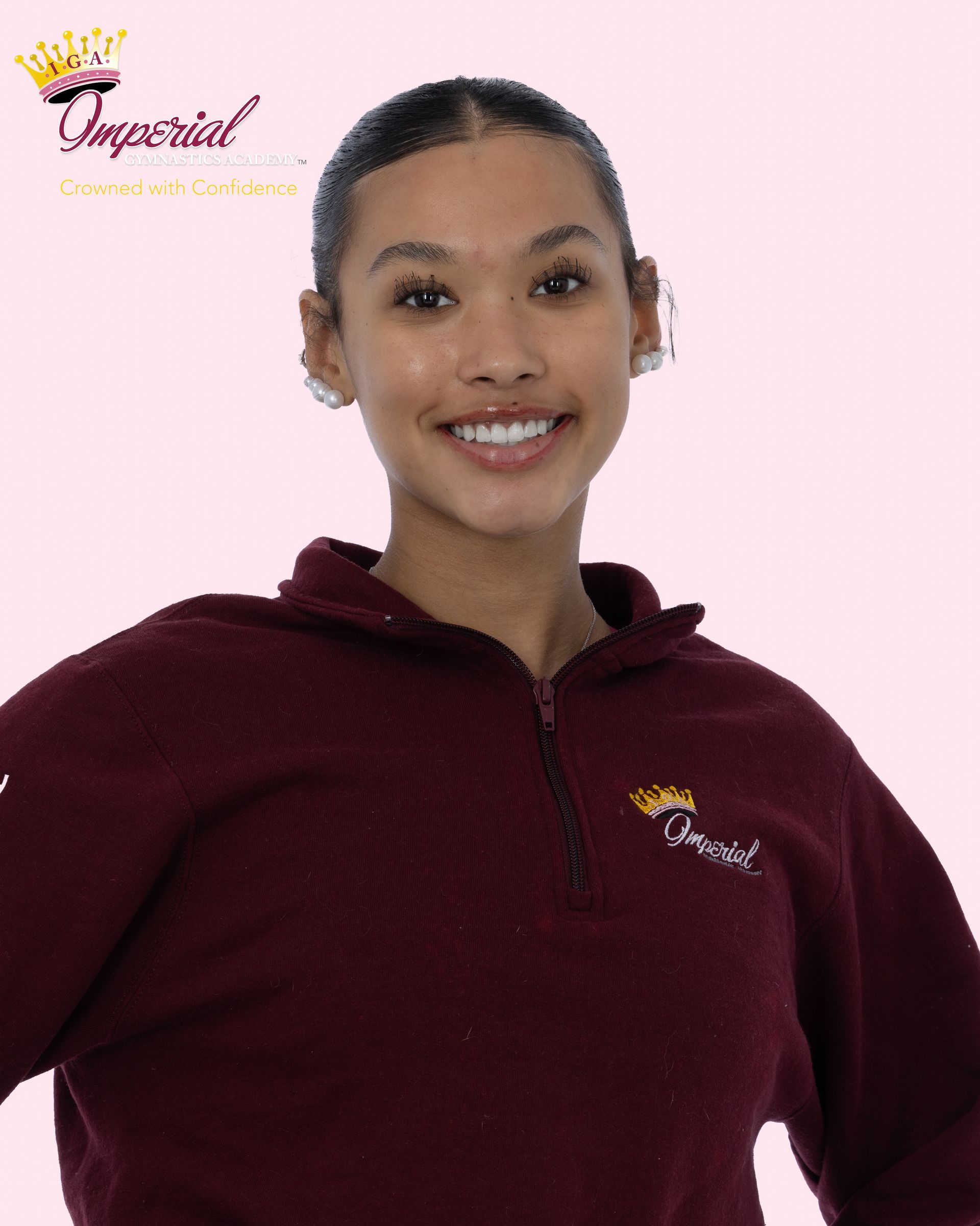 Smiling person wearing a pink t-shirt with 