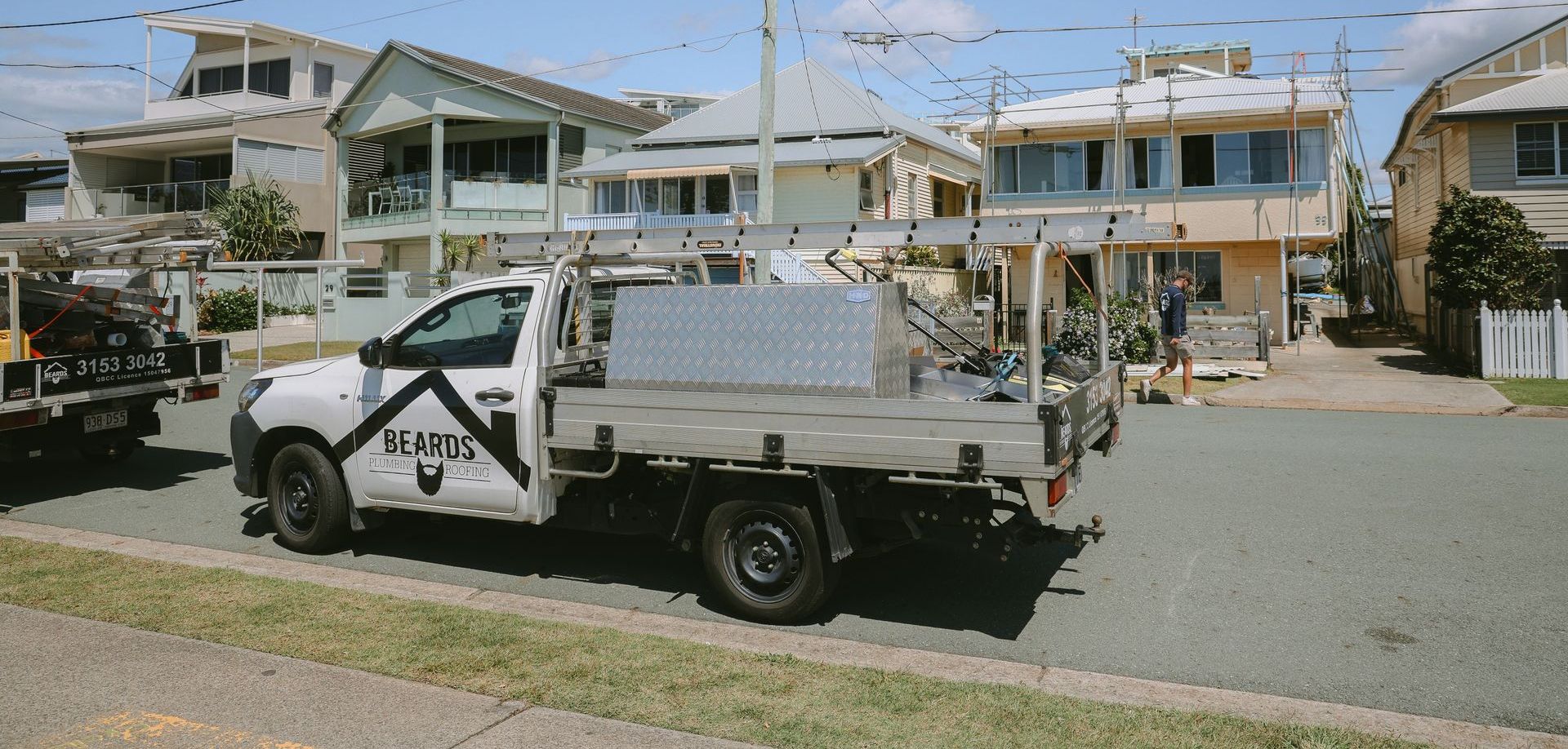 A Plumbing Work Ute Out The Front Of The House — Beards Roofing and Plumbing in Redcliffe, QLD