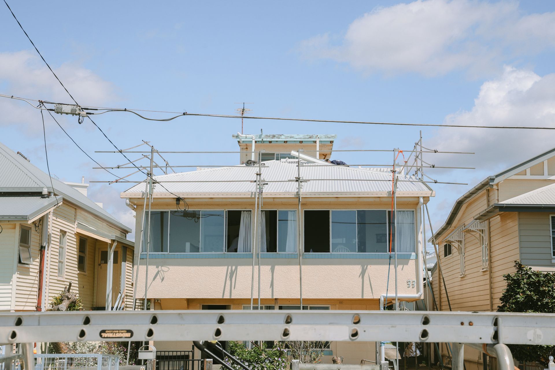 House Under Construction With Scaffolding — Beards Roofing and Plumbing in Clontarf, QLD