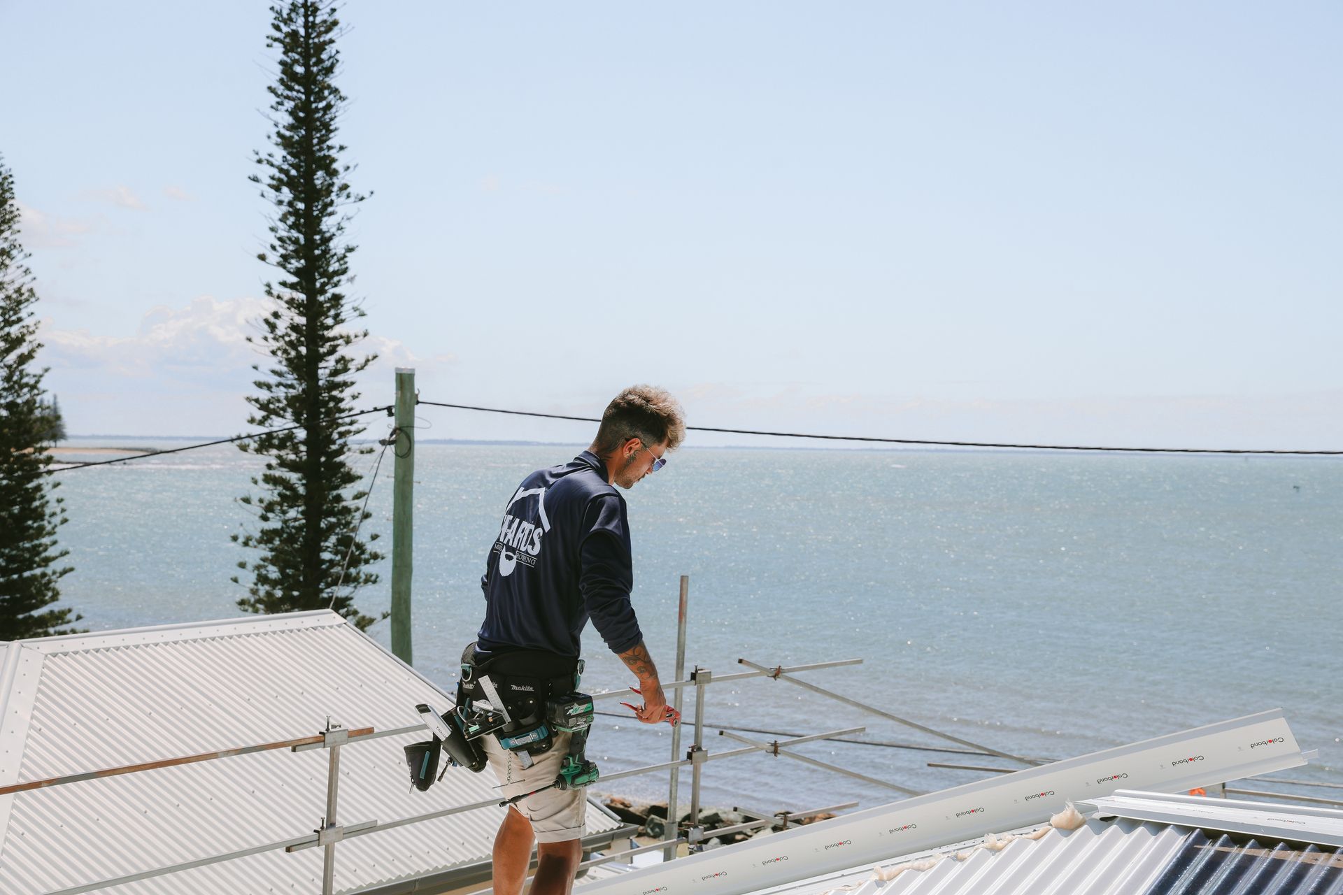 A White Roof With a Metal Railing on Top of It — Beards Roofing and Plumbing in Kallangur, QLD