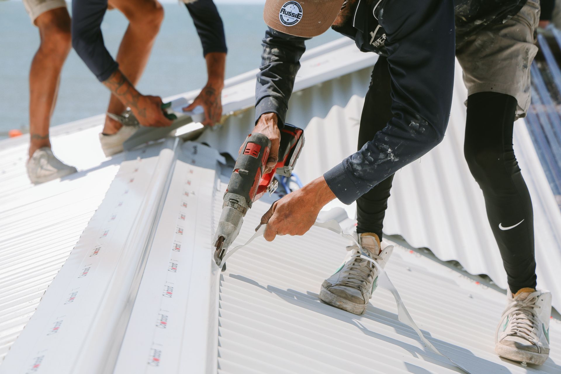 Colorbond Roofing Being Installed On A Roof — Beards Roofing and Plumbing in Caboolture, QLD